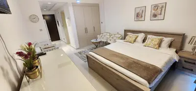 a bedroom with a large bed in a room at Carson Tower C - Damac Hills by Golden Casa in Dubai