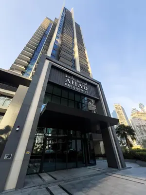 a tall building with a sign on the front of it at Capsule Flora business bay view Burj Khalifa-pool table-game arcade-Projector-Playstation 5 in Dubai
