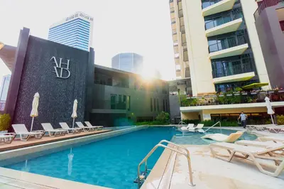 a swimming pool in the middle of a building at Capsule Flora business bay view Burj Khalifa-pool table-game arcade-Projector-Playstation 5 in Dubai