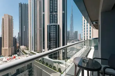 a balcony with a table and a view of a city at LUX 1 bed flat with Burj Khalifa View - 3 minute walk to Dubai Mall - Best Location - Best Balcony View in Dubai