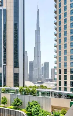 a view of a city with tall buildings at LUX 1 bed flat with Burj Khalifa View - 3 minute walk to Dubai Mall - Best Location - Best Balcony View in Dubai