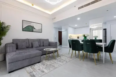 a living room with a couch and a table at Stylish 3bdr apartment in Rimal 2 JBR in Dubai