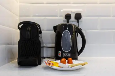 a kitchen counter with a toaster and a plate of food at Stylish 3bdr apartment in Rimal 2 JBR in Dubai