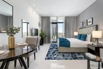 a bedroom with a bed and a dining room at Gorgeous Studio Apartment in DAMAC Celestia B Dubai South by Deluxe Holiday Homes in Dubai