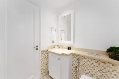 a bathroom with a sink and a mirror at Green living chic 1 bedroom apartment in Dubai