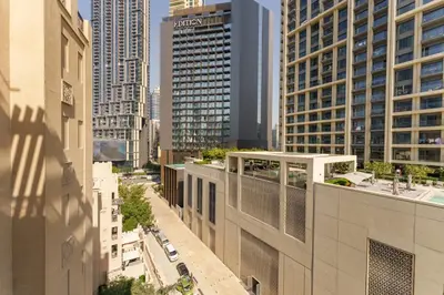 an aerial view of a city with tall buildings at Green living chic 1 bedroom apartment in Dubai
