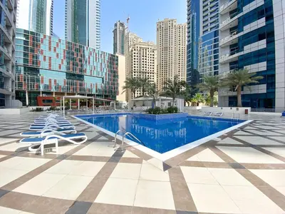 a swimming pool in the middle of a city with buildings at Silkhaus Studio at Dubai Marina Near Marina Mall in Dubai