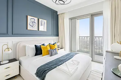 a bedroom with a large bed with yellow and blue walls at Silkhaus Elite 2BDR with View with Pool & Gym in Dubai