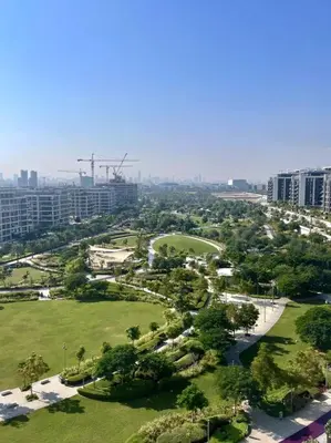 an aerial view of a park with trees and buildings at 3 bedrooms + maids room, Full Park view in Dubai