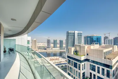 a view of a city from the balcony of a building at Overlooking Canal Views, Fam-Friendly 2BR Unit, Damac Majestine Tower, Business Bay by Deluxe Holiday Homes in Dubai