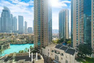 a view of a city skyline with tall buildings at LUX The Stunning Fountain View Suite in Dubai