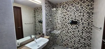 a bathroom with a sink and a mirror at Shaista Azizi Residence - Al Furjan by Golden Casa in Dubai