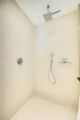 a bathroom with a shower with a shower head at Breathtaking views from Vida Dubai Marina in Dubai