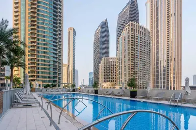 a swimming pool in a city with tall buildings at GuestReady - Glamourous home in Downtown Dubai in Dubai