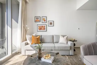 a living room with a couch and a table at GuestReady - Glamourous home in Downtown Dubai in Dubai