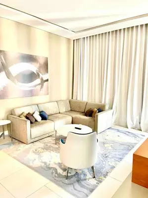 a living room with a couch and a table at Best View Security System Burj Kalifa View in Dubai