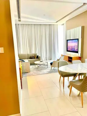 a living room with a couch and a table and chairs at Best View Security System Burj Kalifa View in Dubai