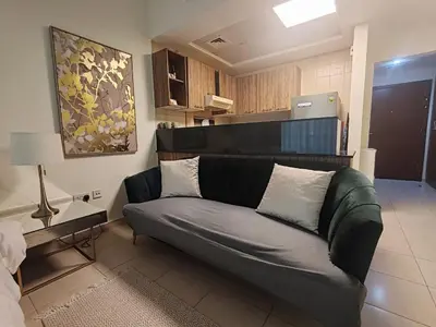 a living room with a couch in a room at Downtown Dubai Mall walk & Burj Khalifa DIFC 5 mins in Dubai