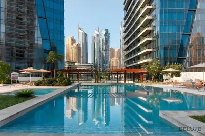 a swimming pool in a city with tall buildings at Beautiful 2BR at Silverene Towers A Dubai Marina by Deluxe Holiday Homes in Dubai