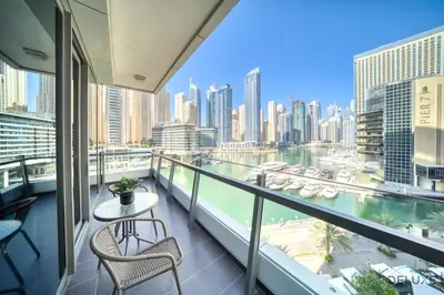 a balcony with a view of a river and buildings at Beautiful 2BR at Silverene Towers A Dubai Marina by Deluxe Holiday Homes in Dubai