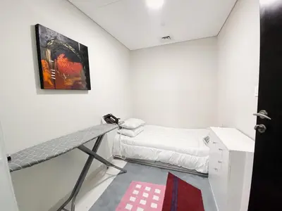 a room with a bed and a painting on the wall at Luxurious & Modern 2BR Plus Maid, Sparkle Tower Dubai Marina - 10AB4 in Dubai