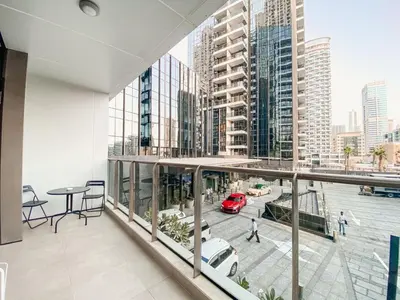 a view of a building with a car on a balcony at Luxurious & Modern 2BR Plus Maid, Sparkle Tower Dubai Marina - 10AB4 in Dubai
