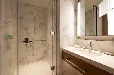 a bathroom with a shower and a sink at SmartStay at Address Opera - Unique Burj Khalifa Views - Brand New Luxury Residences in Dubai