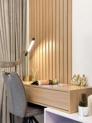 a desk with a lamp and a chair in a room at Mystic - Forte Tower 2 in Dubai