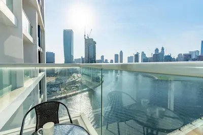a balcony with a view of a city skyline at Mystic - Damac Maison Prive Tower A in Dubai