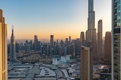 an aerial view of a city with tall buildings at Burj Khalifa & Dubai Dancing Fountain View, 54th Floor & Dubai Mall Access in Dubai