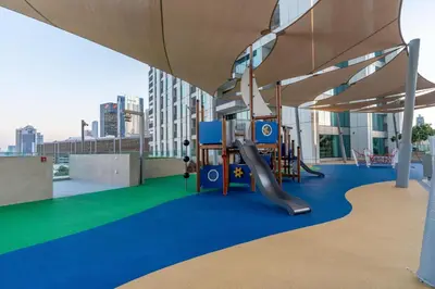 a playground on the roof of a building at Burj Khalifa & Dubai Dancing Fountain View, 54th Floor & Dubai Mall Access in Dubai