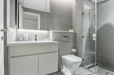 a bathroom with a toilet and a sink and a shower at StoneTree - Modern Studio - Special Offer! in Dubai