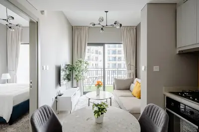 a living room with a bed and a table at Pool View One Bed Room Business Bay in Dubai