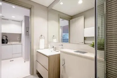 a bathroom with a sink and a mirror at Pool View One Bed Room Business Bay in Dubai