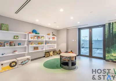 a childs room with a table and a stool at Luxury Studio at Wilton Park - MBR in Dubai