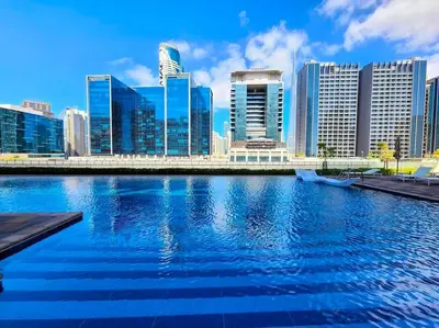 a view of a city with a river with buildings at TruStay Vacation Home Rentals - Business Bay in Dubai