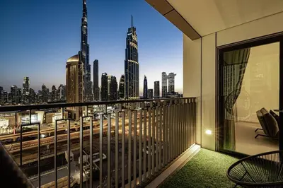 a balcony with a view of a city skyline at Downtown - Burj Khalifa Facing - 2 Bed Luxe Apartment in Dubai