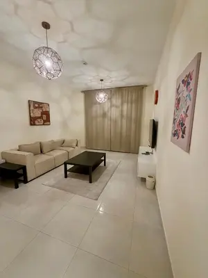a living room with a couch and a table at Cozy Spacious AG Tower Business Bay, Dubai in Dubai