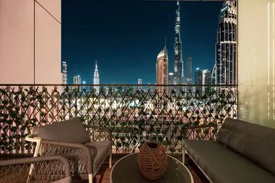 a balcony with a view of a city skyline at Burj Khalifa View, 2 Balcony w Lounge, Dubai Mall Access, Gym, Infinity-Pool, Playground, BBQ, Family Friendly in Dubai