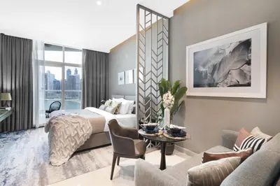 a hotel room with a bed and a couch at The Smart Concierge - Damac Maison Prive in Dubai