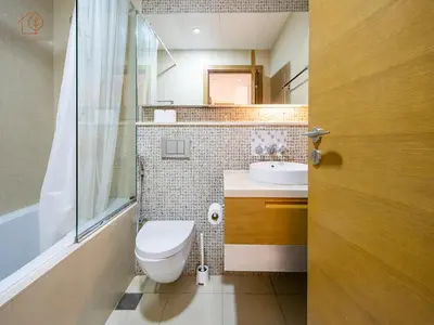 a bathroom with a toilet and a sink at Spacious 1-Bed Apartment Next to Dubai Mall 157CL2-1 in Dubai