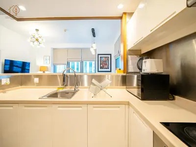 a kitchen with a sink and a microwave at Spacious 1-Bed Apartment Next to Dubai Mall 157CL2-1 in Dubai