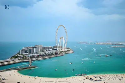 an aerial view of a beach with a ferris wheel at Luxury Escapes - Amazing Sea View - 4 Bedrooms Apt with Maids room in JBR in Dubai