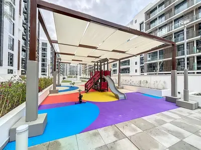 a playground with a slide in a building at Azizi Riviera 16 - Charming Studio in Dubai