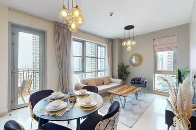 a living room with a table and chairs at Standpoint Tower A - Perfect One Bedroom in Dubai