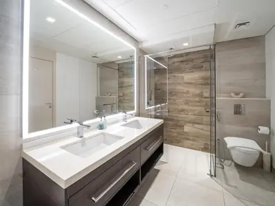 a bathroom with a sink and a shower and a toilet at Upgraded Banyan Tree 2 Bed in JLT in Dubai