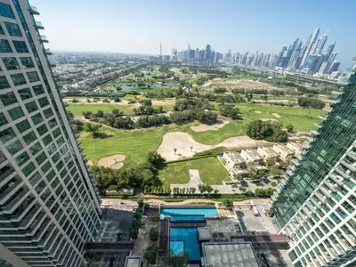 an aerial view of a park between two tall buildings at 2 Bedroom Delight in The Greens Dubai in Dubai