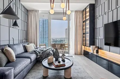 a living room with a couch and a table at The Smart Concierge - Stella Maris in Dubai