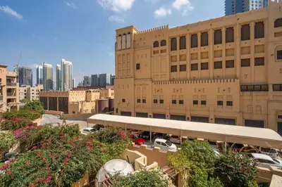 a large building with cars parked in front of it at GuestReady - Groove Getaway in Downtown Dubai in Dubai