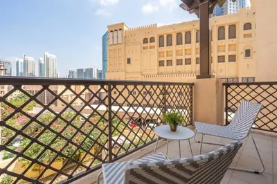 a balcony with two chairs and a table at GuestReady - Groove Getaway in Downtown Dubai in Dubai